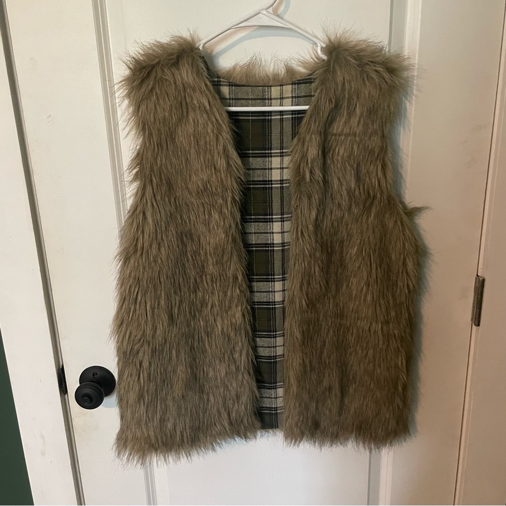 Custom fur vest with green plaid flannel lining. Pockets also lined with flannel